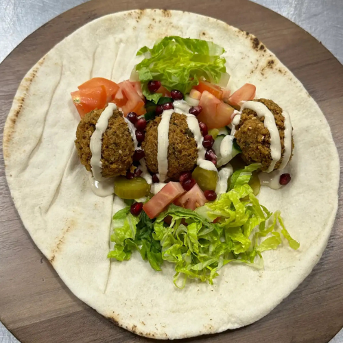 Falafel Sandwich - Crispy fried falafel with fresh vegetables and tahini sauce