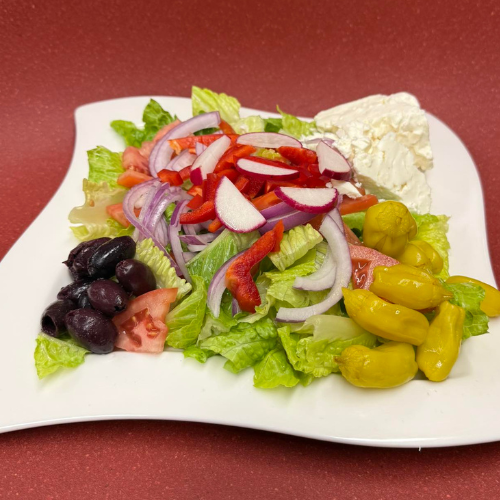 Greek Salad - Tomatoes, cucumbers, olives, and feta cheese with olive oil